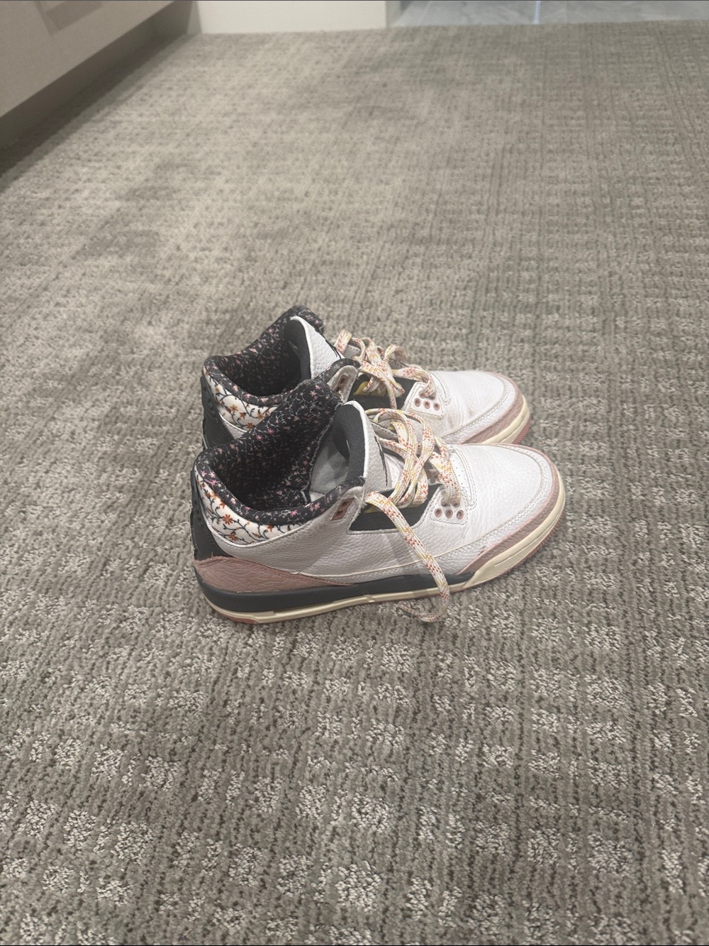 Jordan White High-Top Sneakers with Black and Pink Accents
